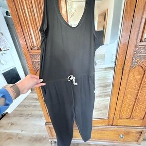Vuori Black Sleeveless Jumpsuit with V-Neck and Wide Legs